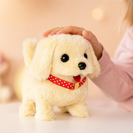 Plush toy dog with a red collar held by a hand against a blurred background