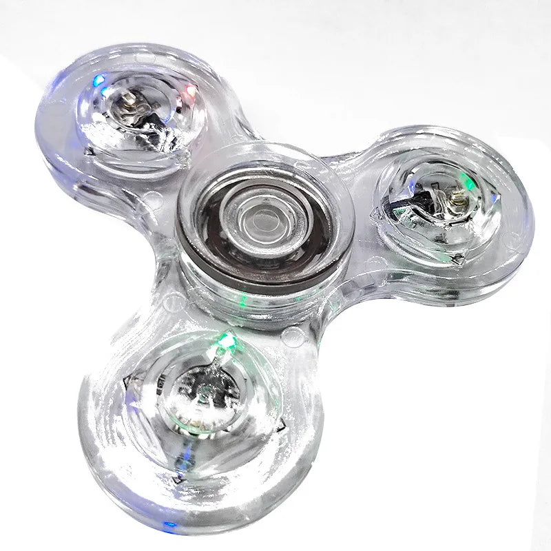 Clear fidget spinner with LED lights on a white background