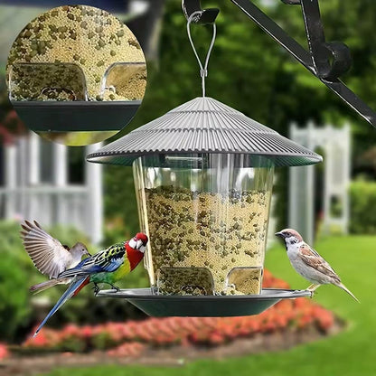 Bird feeder with birds perched on it in a garden setting