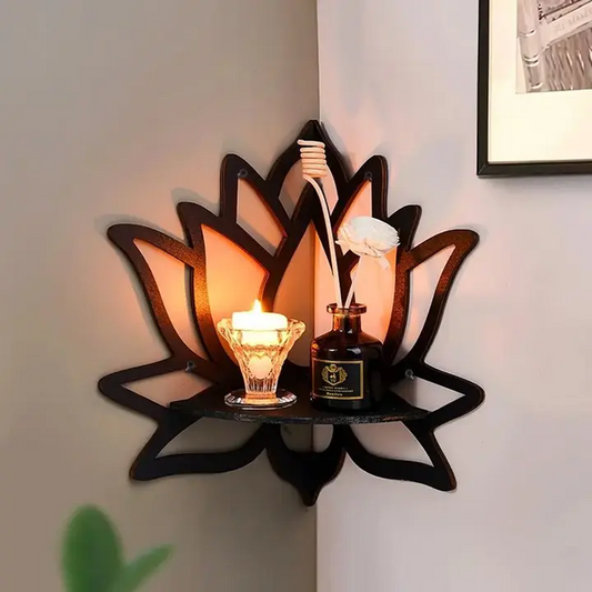Decorative wall shelf with a candle and bottle against a neutral wall.
