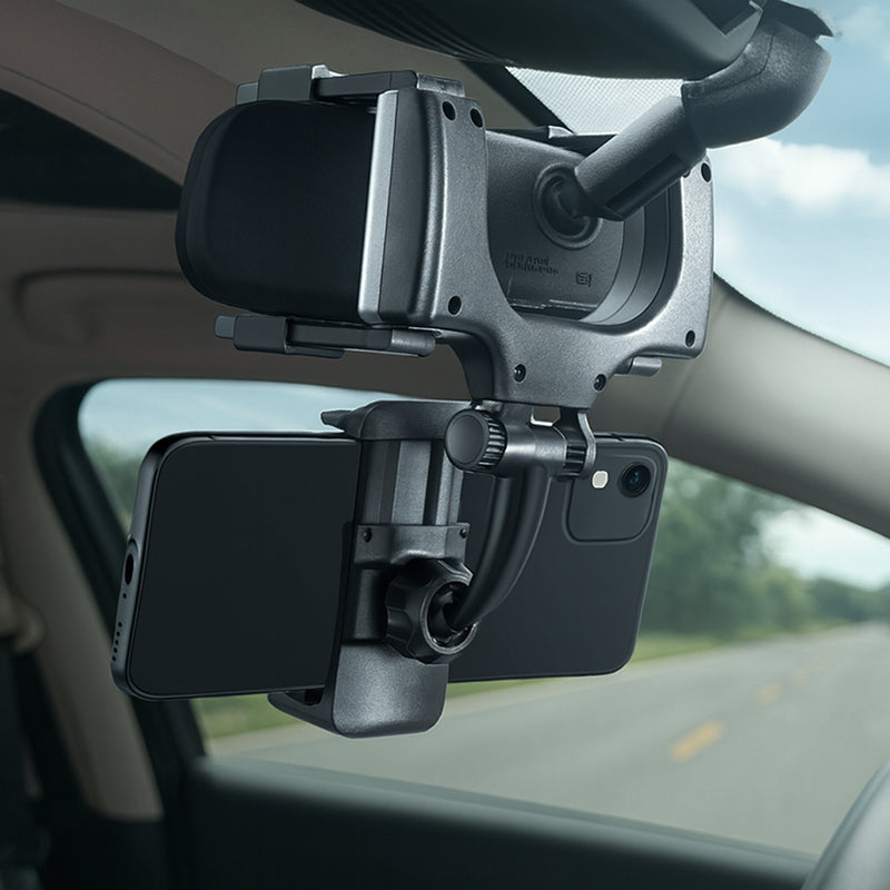 Phone holder attached to a car's dashboard with a clear view of the road.