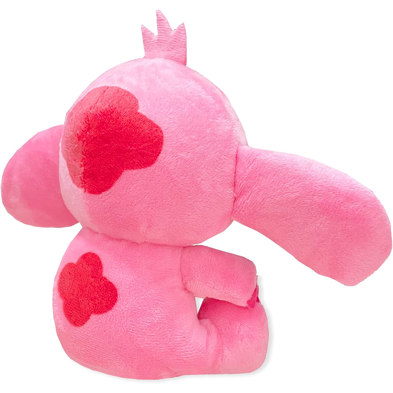 Pink plush toy with red heart patterns on a white background