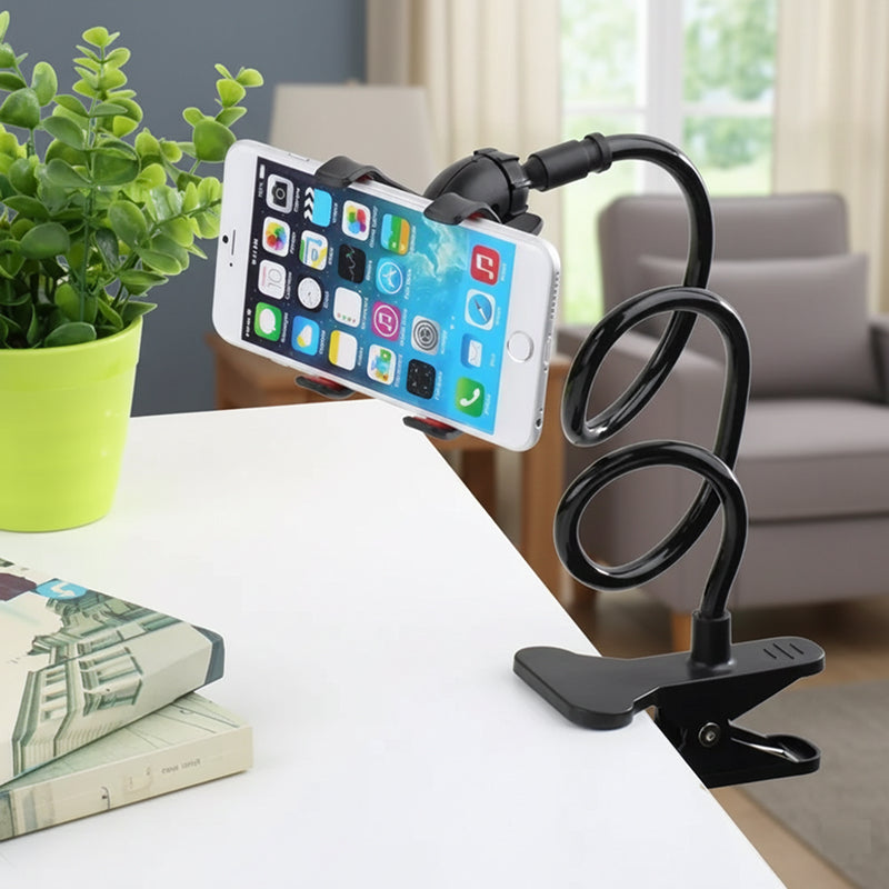 Phone holder with a smartphone on a table in a living room setting