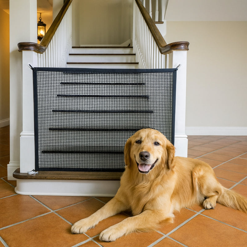 Dog lying on a tiled floor in front of a foldable pet safety gate.