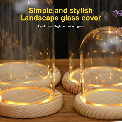 Glass covers with wooden bases on a wooden surface, featuring text about landscape glass cover and crystal clear high borosilicate glass.