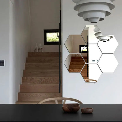 Modern interior with wooden staircase and hexagonal mirrors on the wall.