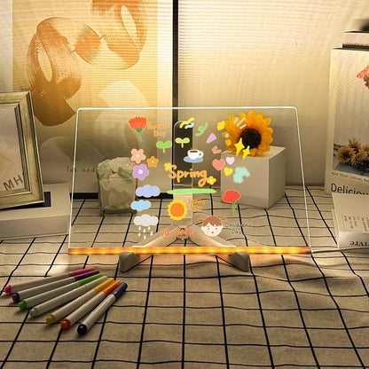 Clear acrylic board with colorful drawings and markers on a checkered floor.