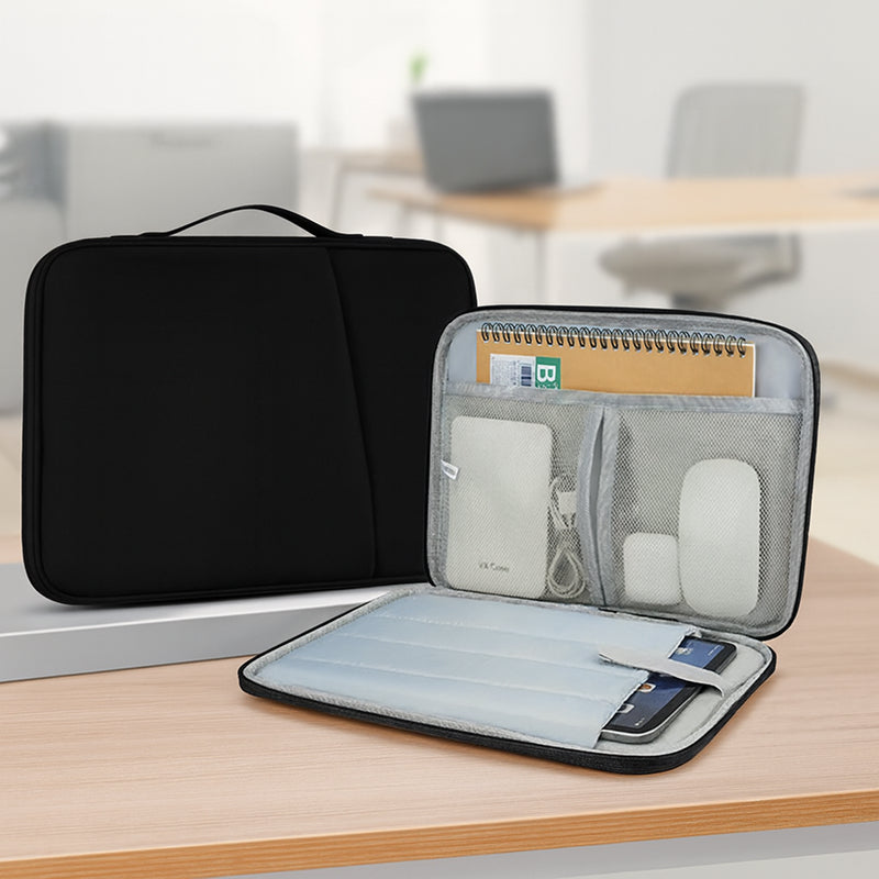 Black and gray laptop bag on a wooden surface with office items inside, blurred office background.