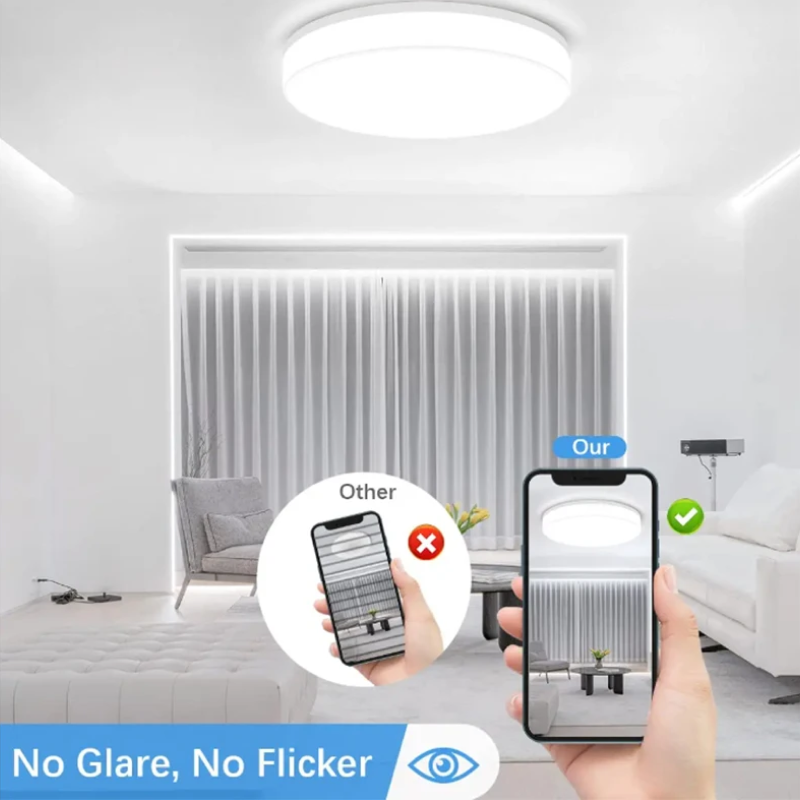 Modern living room with a smartphone app showing a comparison of glare-free and flicker-free lighting.