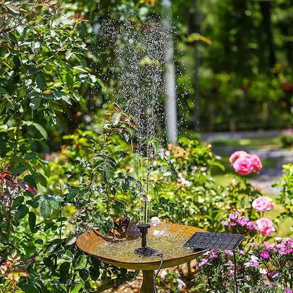 Solar-powered fountain in a garden with flowers and greenery