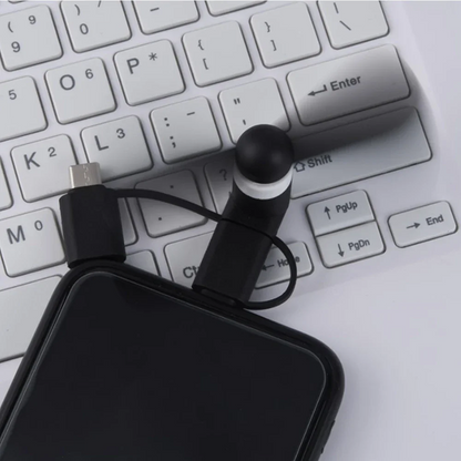 Black phone case with a USB cable on a white keyboard