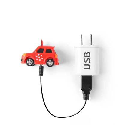 Red car-shaped USB adapter connected to a white USB plug on a white background