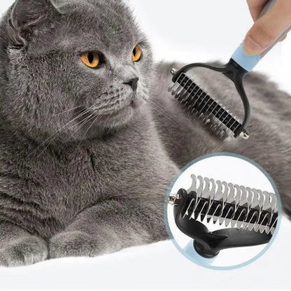 Gray cat being groomed with a pet grooming comb on a white background