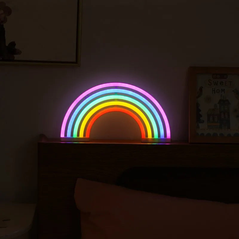 Colorful rainbow-shaped light on a shelf in a dimly lit room
