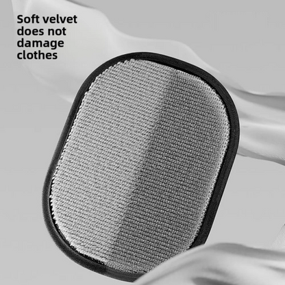 Gray cleaning pad with black border on a white fabric background