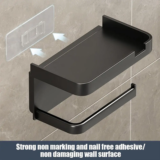 Black bathroom shelf with adhesive backing on a tiled wall