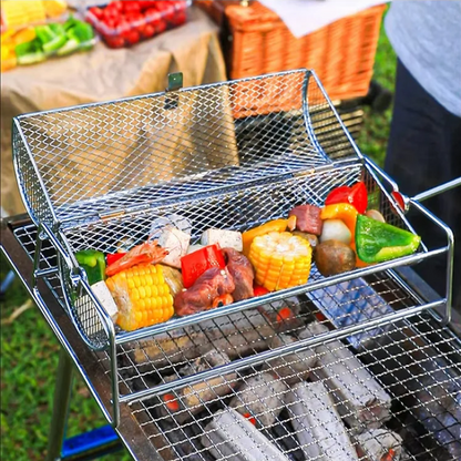 Portable grill with vegetables on a grassy outdoor setting