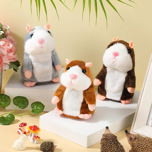 Three plush hamsters on a white surface with decorative elements in the background.
