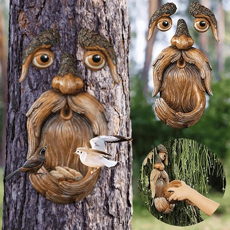 Wooden birdhouse shaped like a face attached to a tree with birds perched on it, surrounded by nature.
