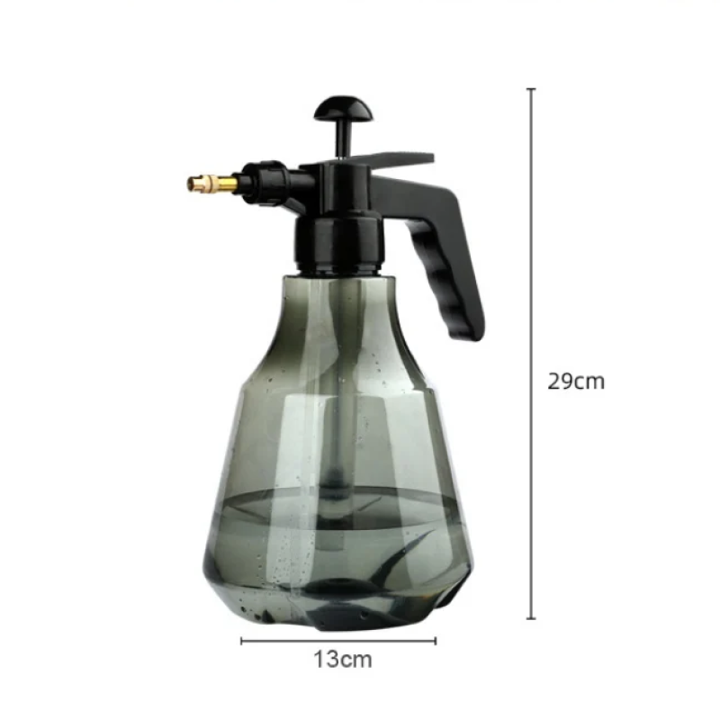Clear spray bottle with black nozzle on a white background