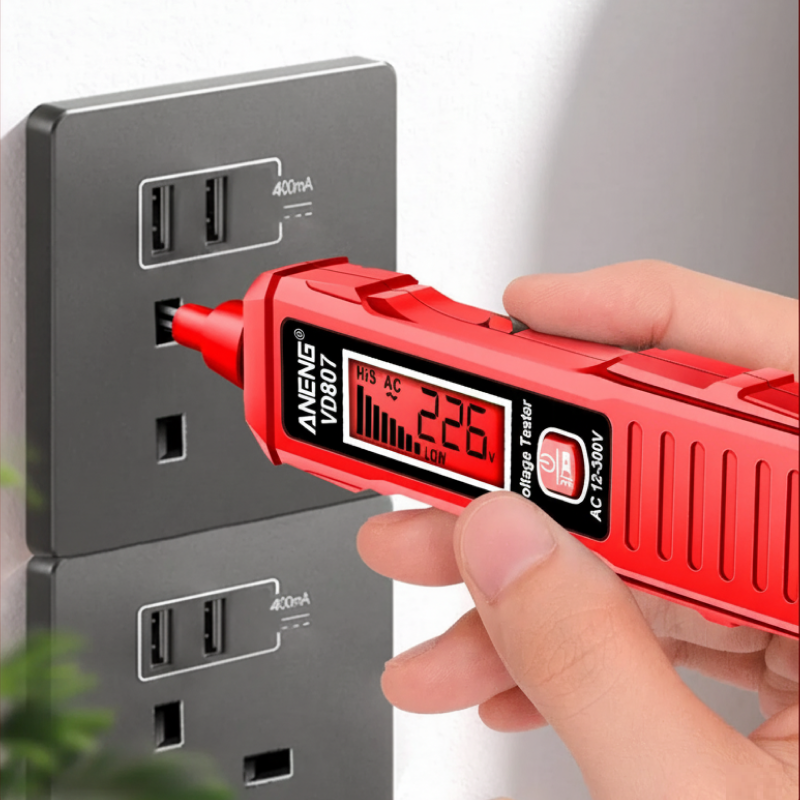 Red voltage tester being used to check a wall socket