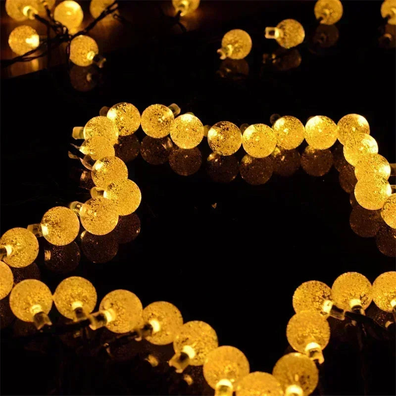 String of gold LED lights on a black background