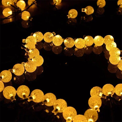 String of gold LED lights on a black background