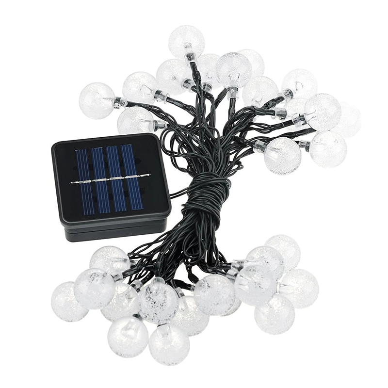 String of white lights with solar panel on a white background